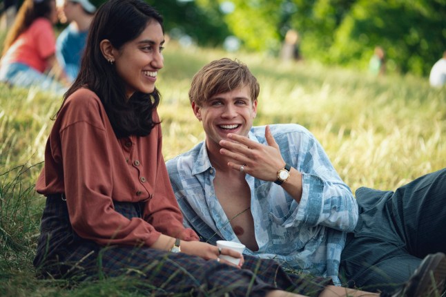 This image released by Netflix shows Ambika Mod, left, and Leo Woodall in a scene from the mini-series "One Day." (Netflix via AP)