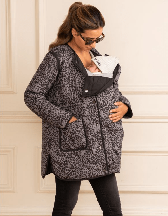 Image of model, holding a baby in Reversible Maternity & Babywearing Jacket from Seraphine