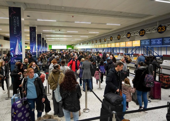 Mandatory Credit: Photo by Ioannis Alexopoulos/LNP/Shutterstock (14268953k) Holidaymakers queue for check-in at Manchester Airport's terminal 1 this morning. Large queues are forming at airports, railway stations, ports and roads as members of the public get away for the Christmas holidays.Photo credit: Ioannis Alexopoulos/LNP Christmas Gateway at Manchester Airport, Manchester, Greater Manchester, UK - 22 Dec 2023