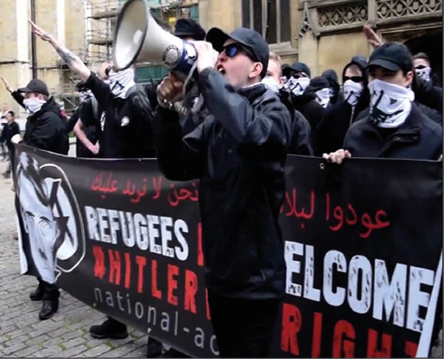 Undated handout photo issued by West Midlands Police of Alex Davies with megaphone at National Action demo in York at end of May 2016. Davies, founder of neo-Nazi group National Action, has been found guilty at Winchester Crown Court of being a member of the group after it was banned. Issue date: Tuesday May 17, 2022. PA Photo. See PA story COURTS Davies. Photo credit should read: West Midlands Police/PA Wire NOTE TO EDITORS: This handout photo may only be used in for editorial reporting purposes for the contemporaneous illustration of events, things or the people in the image or facts mentioned in the caption. Reuse of the picture may require further permission from the copyright holder.