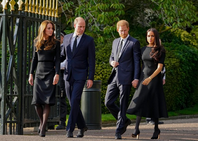 Britain's Prince William, second left, Kate, Princess of Wales, left, Britain's Prince Harry, second right, and Meghan, Duchess of Sussex view the floral tributes for the late Queen Elizabeth II outside Windsor Castle, in Windsor, England on Sept. 10, 2022. (AP Photo/Martin Meissner, File)