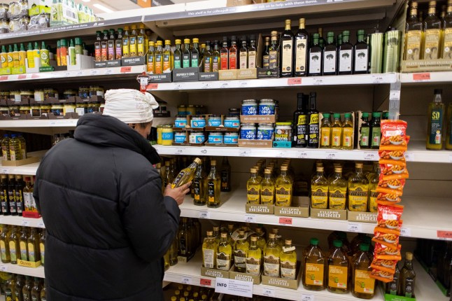 Mandatory Credit: Photo by TOLGA AKMEN/EPA-EFE/REX/Shutterstock (13768865l) Customers shop for olive oil at Sainsbury's supermarket in London, Britain, 15 February 2023. According to the Office for National Statistics (ONS), UK's inflation rate fell for the third month in a row to 10.1 percent in January 2023, however inflation on food products is at a 45-year high with olive oil, sugar and milk prices have gone up by more than 40 percent from January 2022. UK inflation rate falls but food inflation remains high, London, United Kingdom - 15 Feb 2023