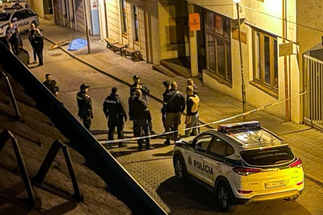 This picture taken on October 12, shows Police patroling the cordoned off Zamocka street in downtown Bratislava, Slovakia following a shooting. - Two men have been shot dead at a gay bar in Slovakia's capital Bratislava, Slovak police said on October 13, with local media reporting that the shooting may have been a hate crime. "This morning, the police found the gunman dead," police spokesman Michal Slivka told AFP, declining to comment on possible motives. (Photo by VLADIMIR SIMICEK / AFP) (Photo by VLADIMIR SIMICEK/AFP via Getty Images)