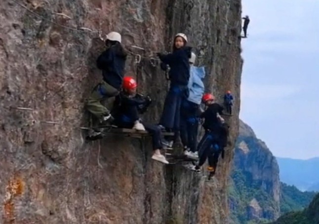 Undated drone footage of tourists climbing a mountainside at Yandang Mountain, China. The scenic spot has a capacity limit of about 400 people a day, and the passenger flow increased significantly during the May Day holiday. (rosy bird/AsiaWire)