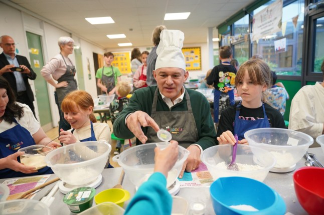 Liberal Democrats leader Sir Ed Davey taking part in a baking lesson with students from High Beeches Primary School during a half-term holiday camp in Hertfordshire, while on the General Election campaign trail. Picture date: Friday May 31, 2024. PA Photo. See PA story POLITICS Election LibDems. Photo credit should read: Yui Mok/PA Wire