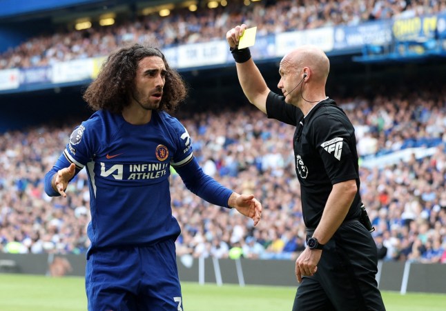 Soccer Football - Premier League - Chelsea v AFC Bournemouth - Stamford Bridge, London, Britain - May 19, 2024 Chelsea's Marc Cucurella is shown a yellow card by referee Anthony Taylor REUTERS/Isabel Infantes EDITORIAL USE ONLY. NO USE WITH UNAUTHORIZED AUDIO, VIDEO, DATA, FIXTURE LISTS, CLUB/LEAGUE LOGOS OR 'LIVE' SERVICES. ONLINE IN-MATCH USE LIMITED TO 120 IMAGES, NO VIDEO EMULATION. NO USE IN BETTING, GAMES OR SINGLE CLUB/LEAGUE/PLAYER PUBLICATIONS. PLEASE CONTACT YOUR ACCOUNT REPRESENTATIVE FOR FURTHER DETAILS..