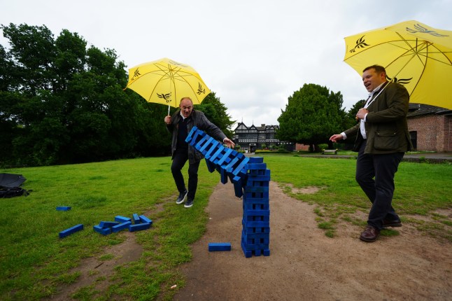 Liberal Democrats leader Sir Ed Davey and Liberal Democrat Parliamentary Candidate for Cheadle, Tom Morrison play Jenga during a visit to Cheadle, Greater Manchester, while on the General Election campaign trail. Picture date: Tuesday June 4, 2024. PA Photo. See PA story POLITICS Election LibDems. Photo credit should read: Peter Byrne/PA Wire