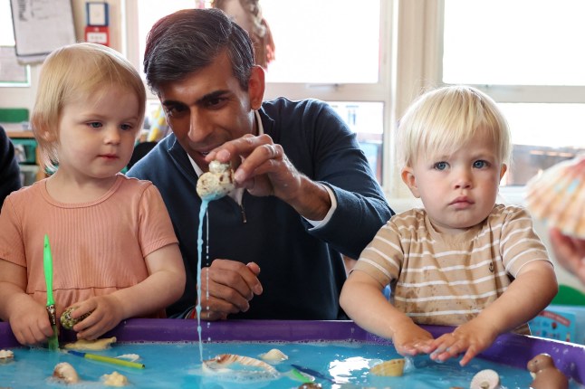 British Prime Minister Rishi Sunak plays with children as he visits the Imagination Childcare children's centre during a Conservative general election campaign event in Swindon, Britain, June 7, 2024. REUTERS/Phil Noble/Pool