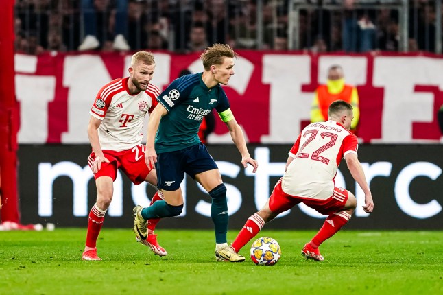 MUNICH, GERMANY - APRIL 17: Martin Odegaard of Arsenal looks on to pass the ball during the UEFA Champions League quarter-final second leg match between FC Bayern M??nchen and Arsenal FC at Allianz Arena on April 17, 2024 in Munich, Germany. (Photo by Daniela Porcelli/Eurasia Sport Images/Getty Images)