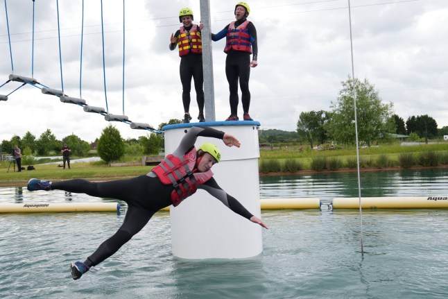 Liberal Democrats leader Sir Ed Davey falls as he attempts an Aqua Jungle floating assault course during a visit to Spot-On-Wake in Henley-in-Arden, Warwickshire, while on the General Election campaign trail. Picture date: Wednesday June 12, 2024. PA Photo. See PA story POLITICS Election LibDems. Photo credit should read: Jacob King/PA Wire