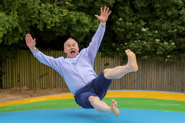 ? Licensed to London News Pictures. 15/06/2024. Surrey, UK. SIR ED DAVEY, Liberal Democrats leader, takes part in a pillow trampoline at Bocketts Farm?in Dorking, Surrey, during the leader?s tour ahead of the General Election on 4 July 2024. Photo credit: Dinendra Haria/LNP