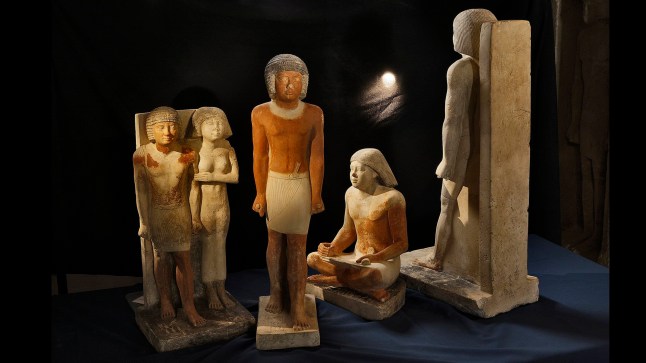 *EMBARGOED UNTIL 16.00 BST, THURS JUNE 27 (11.00 ET)* Statues depicting the high dignitary Nefer and his wife (Abusir, Egypt). Photo released June 27 2024. Scribes in Ancient Egypt suffered hip, spine and shoulder problems from sitting cross-legged with their head bent forwards for hours on end, suggests new research.The study of 4,000-year-old male skeletons revealed the occupational hazards of the repetitive tasks conducted by high status men with the ability to write who performed administrative tasks.The positions they sat in while working may have led to degenerative skeletal changes - including indentations on both kneecaps and a flattened surface on a bone in the lower part of the right ankle, say scientists.Study leader Dr Petra Brukner Havelkova and her colleagues examined the skeletal remains of 69 adult males, 30 of whom were scribes, buried in the necropolis at Abusir, Egypt, between 2700BC and 2180BC.