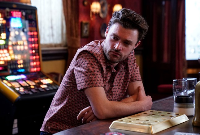 Johnny looking worried in the Vic in EastEnders