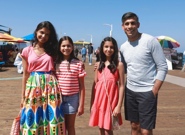 British Prime Minister Rishi Sunak, his wife Akshata Murty and his daughters Anoushka Sunak and Krishna Sunak pose for a photo at Santa Monica Pier in Santa Monica, California, August 3, 2023. Emma McIntyre/Pool via REUTERS