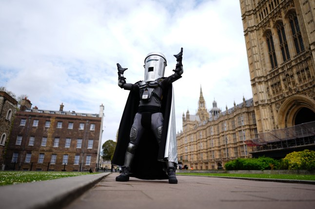 Mayor of London election candidate Count Binface poses outside Parliament on College Green, central London.