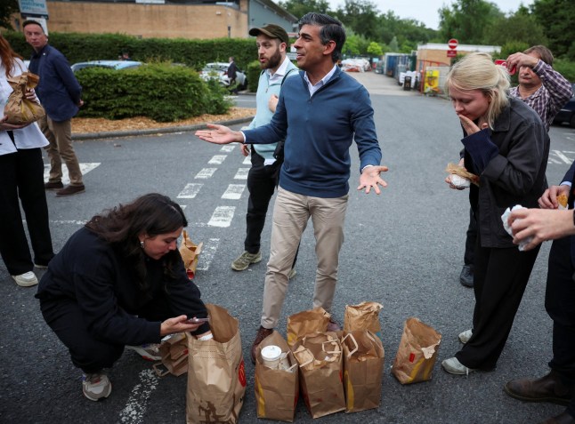 Britain's Prime Minister and Conservative Party leader Rishi Sunak purchases McDonald's breakfast from a Beaconsfield service station in Buckinghamshire on July 2, 2024 on the campaign trail in the build-up to the July 4 general election. (Photo by Phil Noble / POOL / AFP) (Photo by PHIL NOBLE/POOL/AFP via Getty Images)