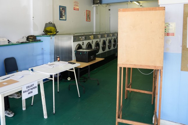 A polling station that has been installed inside a launderette in Oxford, as people in the United Kingdom go to the polls in the 2024 General Election. Picture date: Thursday July 4, 2024. PA Photo. See PA story POLITICS Election. Photo credit should read: Jacob King/PA Wire