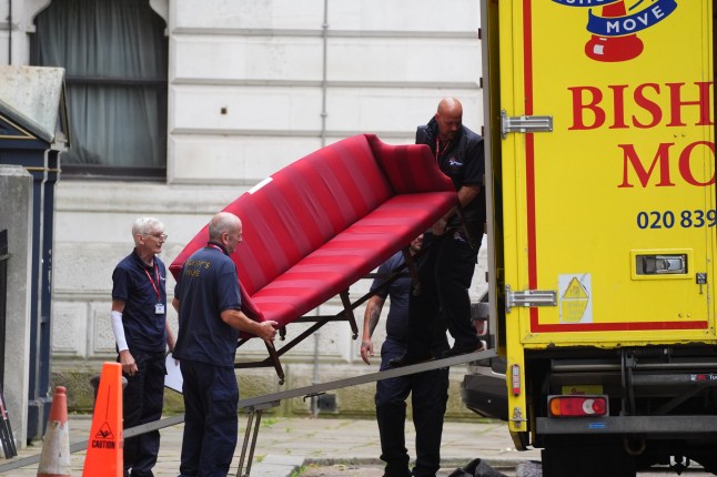 Removal men from the company Bishop's Move, which specialises in removals, storage and shipping, carry a sofa at the back of Downing Street, London, following the Labour Party's victory in the 2024 General election. Picture date: Sunday July 7, 2024. PA Photo. Photo credit should read: James Manning/PA Wire