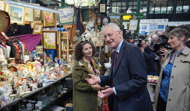 Northern Ireland Secretary Hilary Benn speaks with a market trader during a visit to St George's Market in Belfast, following the Labour Party's victory in the 2024 General election. Picture date: Sunday July 7, 2024. PA Photo. See PA story POLITICS Labour. Photo credit should read: Niall Carson/PA Wire