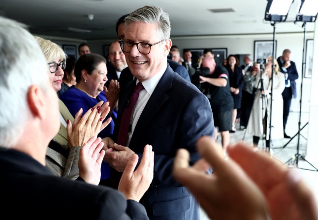 EDINBURGH, SCOTLAND - JULY 7: Prime Minister Sir Keir Starmer (C) arrives at DoubleTree by Hilton Hotel to meet with Scottish Labour leader Anas Sarwar (L) on July 7, 2024 in Edinburgh, Scotland. This is the first meeting between the new Prime Minister and the Scottish Labour leader after Labour's historic landslide victory in the UK general election. It begins Sir Keir Starmer's four-nation tour, starting in Scotland, then moving to Northern Ireland and Wales, before returning to England. (Photo by Jeff J Mitchell/Getty Images)