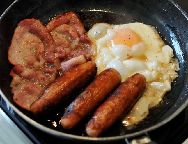 EMBARGOED TO 1200 WEDNESDAY JULY 31 File photo dated 27/08/14 of egg, sausages and bacon being fried in a frying pan. Swapping bacon and sausages for nuts, beans and tofu could potentially help cut a person's dementia risk, a new study suggests. A large new research project analysed the links between processed red meat consumption and a person???s risk of developing dementia. Issue date: Wednesday July 31, 2024. PA Photo. See PA story HEALTH Dementia. Photo credit should read: Nicholas.T. Ansell/PA Wire