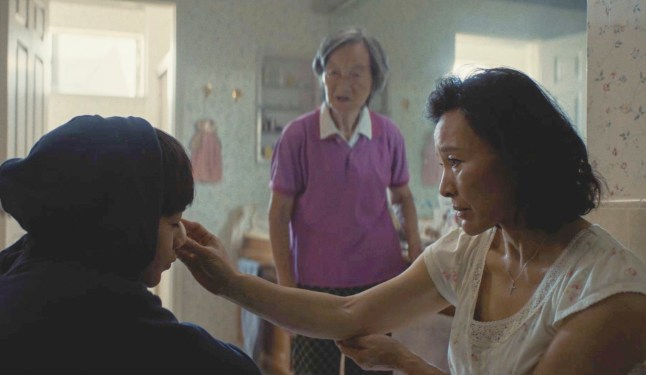 This image released by Focus Features shows Izaac Wang, Chang Li Hua, and Joan Chen in a scene from "D??DI." (Focus Features via AP)