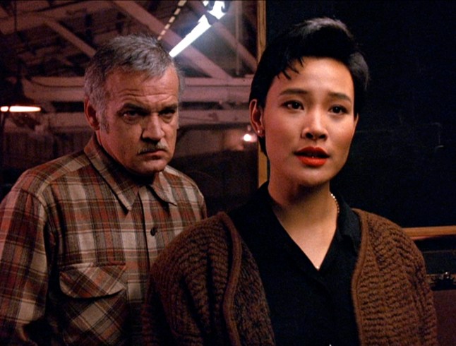 Chinese-born American actress Joan Chen (as Josie Packard) (fore) and American actor Jack Nance (1943 - 1996) (as Pete Martell) in a still from the pilot episode of the television series 'Twin Peaks,' originally broadcast on April 8, 1990. (Photo by CBS Photo Archive/Getty Images)