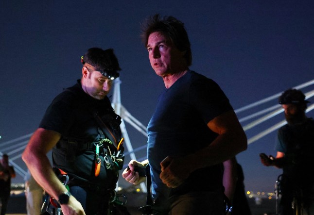 Paris 2024 Olympics - Ceremonies - Paris 2024 Closing Ceremony - Stade de France, Saint-Denis, France - August 11, 2024. Actor Tom Cruise is pictured on the roof of the Stade de France during the closing ceremony. REUTERS/Fabrizio Bensch/Pool