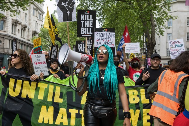 Chantelle Lunt, founder of Merseyside BLM Alliance, marches in front of activists from civil liberties groups taking part in a Kill The Bill National Day of Action in protest against the Police, Crime, Sentencing and Courts (PCSC) Bill 2021 on 29th May 2021 in London, United Kingdom. The PCSC Bill would grant the police a range of new discretionary powers to shut down protests, including the ability to impose conditions on any protest deemed to be disruptive to the local community, wider stop and search powers and sentences of up to 10 years in prison for damaging memorials. (photo by Mark Kerrison/In Pictures via Getty Images)