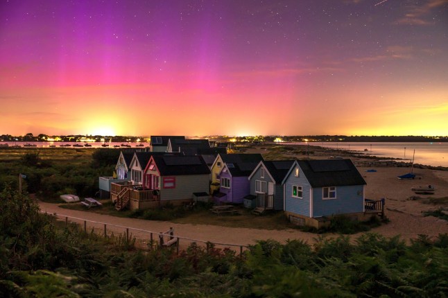 The Northern Lights over Mudeford Spit beach huts near Christchurch in Dorset at 1.45am this morning (Tuesday). The Aurora was strong and could be seen with the naked eye on the South Coast. Dated 13/08/24. Please credit: Steve Hogan/pictureexclusive.com Standard reproduction rates apply, contact Paul Jacobs, Picture Exclusive to arrange payment - 07923 866166, pictureexclusive@gmail.com