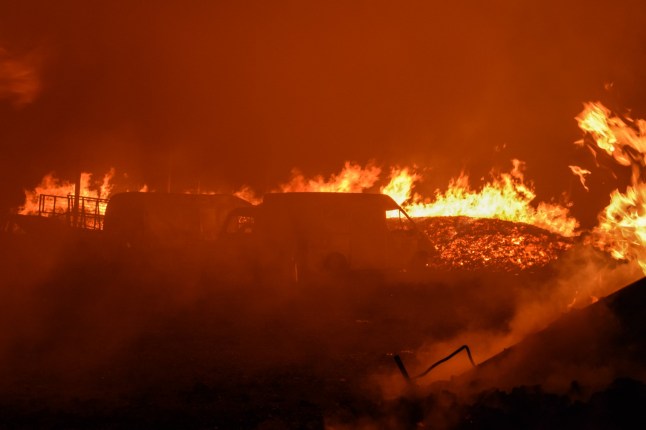 Mandatory Credit: Photo by Dimitris Aspiotis/Shutterstock (14634186ao) Cars burn as a timber warehouse goes up in flames in Gerakas suburb of the Greek capital during a wildfire that burned houses. A wildfire that broke out in Varnavas on 11 August continued to rage in eastern Attica on 12 August, fanned and spread to a front extending more than 20 kilometers. Several countries have responded positive to the request of Greek authorities for assistance from the EU Civil Protection Mechanism (EUCPM) to combat the wildfire raging. Wildfire reaches suburbs burning houses, Athens, Greece - 12 Aug 2024