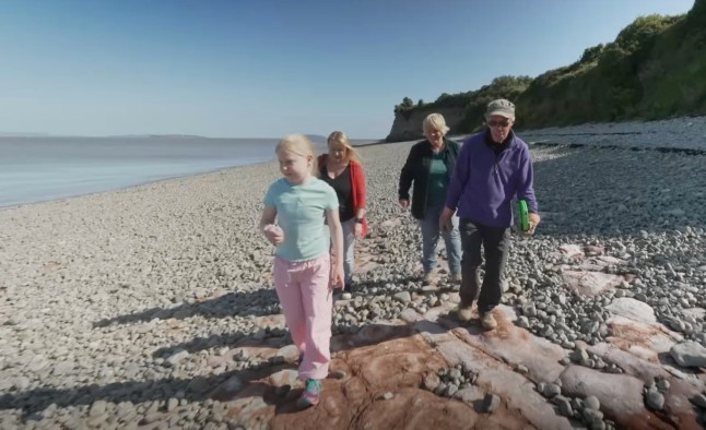 A 10-year-old schoolgirl stunned experts when she unearthed dinosaur footprints while playing on a beach during a summer holiday walk. The youngster, named only as Tegan, was scouring the beach when she spotted a series of similar shaped holes on the stoney shore. Tegan believed the footprints could date back to pre-historic times - and her mum Claire contacted palaeontologists to find out. And museum experts believe the five footprints, found near Penarth, South Wales, are more than 200million years old and could belong to a dinosaur called the camoltia - part of the sauropodomorpha sub order. Pictured here is Tegan showing experts the footprints WALES NEWS SERVICE