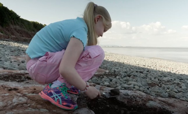 A 10-year-old schoolgirl stunned experts when she unearthed dinosaur footprints while playing on a beach during a summer holiday walk. The youngster, named only as Tegan, was scouring the beach when she spotted a series of similar shaped holes on the stoney shore. Tegan believed the footprints could date back to pre-historic times - and her mum Claire contacted palaeontologists to find out. And museum experts believe the five footprints, found near Penarth, South Wales, are more than 200million years old and could belong to a dinosaur called the camoltia - part of the sauropodomorpha sub order. Pictured here is Tegan WALES NEWS SERVICE