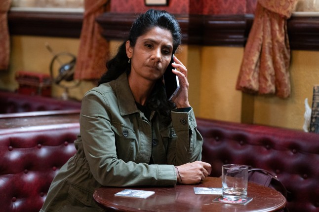 Suki on the phone in the pub in EastEnders