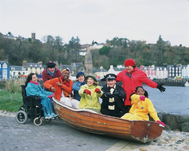 TELEVISION PROGRAMME: BALAMORY. Picture shows: KIM TSERKEZIE as Penny Pocket, MILES JUPP as Archie, RODD CHRISTENSEN as Spencer, JULIET CADZOW as Edie McCredie, JULIE WILSON NIMMO as Ms Hoolie, ANDREW AGNEW as PC Plum, MARY RIGGANS as Suzie Sweet and KASAI HADDAD as Josie Jump. TX:CBeebies, Monday, 20 September, 2004. Bigger and brighter than before, Balamory is back on CBeebies with new music, sets and even more exciting play days guaranteed to keep children entertained. WARNING: Use of this copyright image is subject to Terms of Use of BBC Digital Picture Service. In particular, this image may only be used during the publicity period for the purpose of publicising 'BALAMORY' and provided the BBC is credited. Any use of this image on the internet or for any other purpose whatsoever, including advertising or other commercial uses, requires the prior written approval of BBC. (Mary Riggans died 2/12/2013)