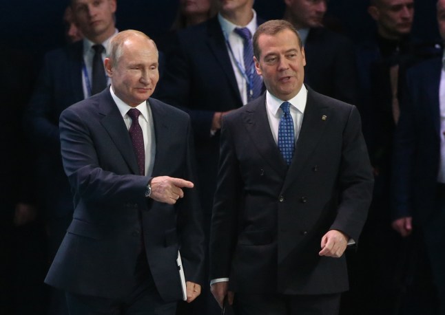 MOSCOW, RUSSIA - NOVEMBER 23: (RUSSIA OUT) Russian President Vladimir Putin (L) and Prime Minister Dmitry Medvedev (R) enter the hall during the XIX Congress of United Russia Party on November 23, 2019 in Moscow, Russia. President Vladimir Putin has visited the congress of the Kremlin-backed leading parliament party, created in 2001. (Photo by Mikhail Svetlov/Getty Images)