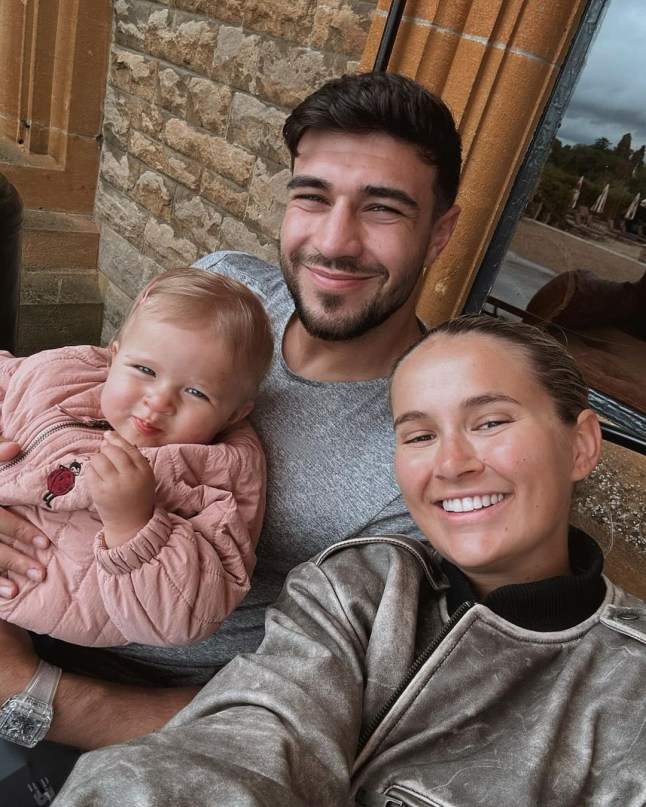 Molly Mae poses with Tommy Fury and their young daughter, Bambi