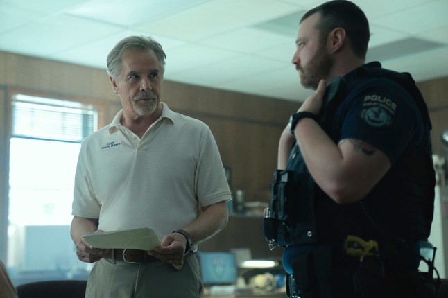 This image released by Netflix shows Don Johnson as Chief Sandy Burnne, left, and Emory Cohen as Officer Steve Lann in a scene from "Rebel Ridge." (Allyson Riggs/Netflix via AP)