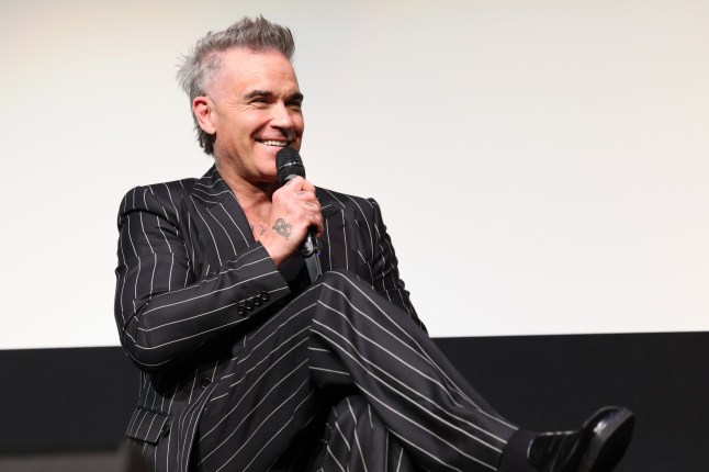 TORONTO, ONTARIO - SEPTEMBER 09: Robbie Williams speaks onstage during the "Better Man" Canadian Premiere at the Toronto International Film Festival at Roy Thomson Hall on September 09, 2024, in Toronto, Ontario. (Photo by Monica Schipper/Getty Images for Paramount Pictures)