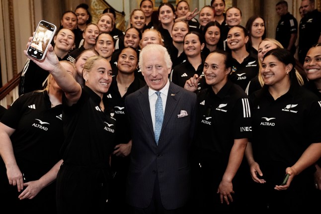 King Charles III has his photograph taken with New Zealand's Black Ferns rugby union team on the Grand Staircase at Buckingham Palace in London. Picture date: Wednesday September 11, 2024. PA Photo. See PA story ROYAL King. Photo credit should read: Aaron Chown/PA Wire