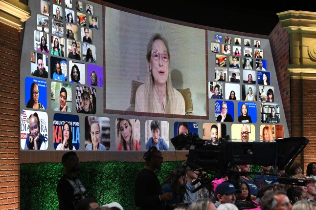 US actress Meryl Streep appears on screen as US Vice President and Democratic presidential candidate Kamala Harris joins US television producer Oprah Winfrey at a 'Unite for America' live streaming rally in Farmington Hills, Michigan, on September 19, 2024. (Photo by SAUL LOEB / AFP) (Photo by SAUL LOEB/AFP via Getty Images)