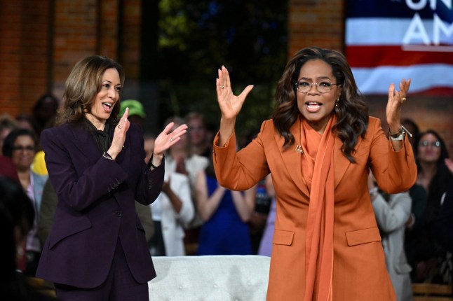 TOPSHOT - US Vice President and Democratic presidential candidate Kamala Harris (L) joins US television producer Oprah Winfrey at a 'Unite for America' live streaming rally in Farmington Hills, Michigan, on September 19, 2024. (Photo by SAUL LOEB / AFP) (Photo by SAUL LOEB/AFP via Getty Images)