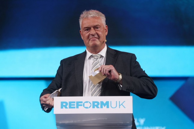 Lee Anderson rips a letter from BBC Television Licensing as he speaks during Britain's Reform UK party's national conference in Birmingham, Britain, September 20, 2024. REUTERS/Hollie Adams