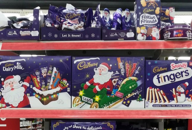 Aisle view of CADBURY Dairy Milk chocolate products display for sell in the supermarket