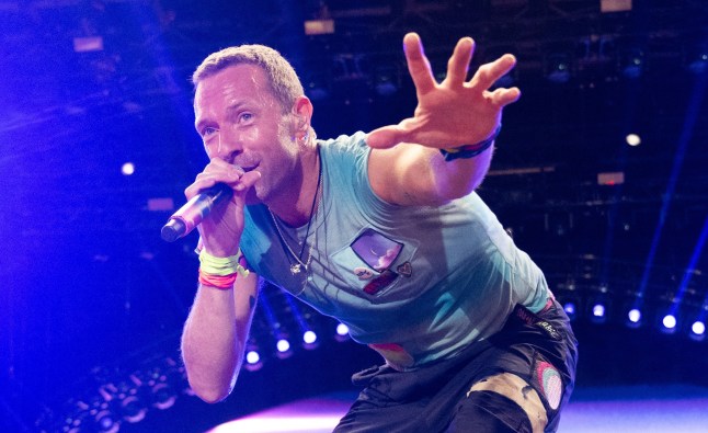 Chris Martin of Coldplay performs as the band headline the Pyramid stage during day four of Glastonbury Festival 2024 at Worthy Farm