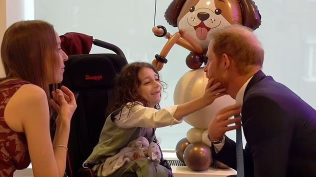 Prince Harry upstaged by 'boisterous' little boy during charity event in London