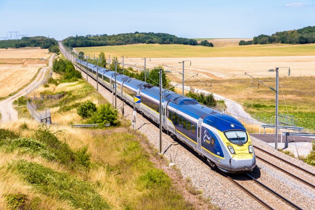 A Eurostar high-speed train in the countryside.