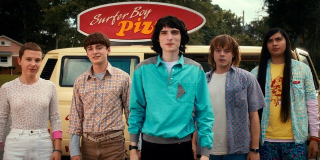 This image released by Netflix shows, from left, Millie Bobby Brown as Eleven, Noah Schnapp as Will Byers, Finn Wolfhard as Mike Wheeler, Charlie Heaton as Jonathan Byers, and Eduardo Franco as Argyle in "Stranger Things." The series was nominated for 13 Emmy Awards including one for best drama series. (Netflix via AP)