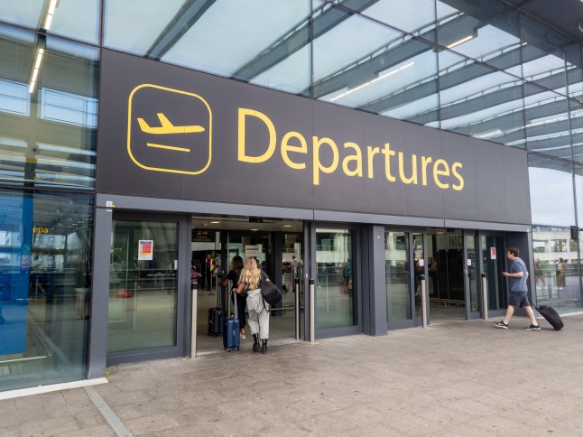 Gatwick Airport departures terminal sign pictured from outside.