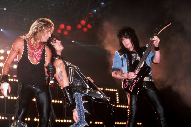 DETROIT - JULY 20: M??tley Cr??e lead singer Vince Neil, co-founder and bass player Nikki Sixx and guitarist Mick Mars perform onstage at the Joe Louis Arena, on July 20, 1987, in Detroit, Michigan. (Photo by Ross Marino/Getty Images)